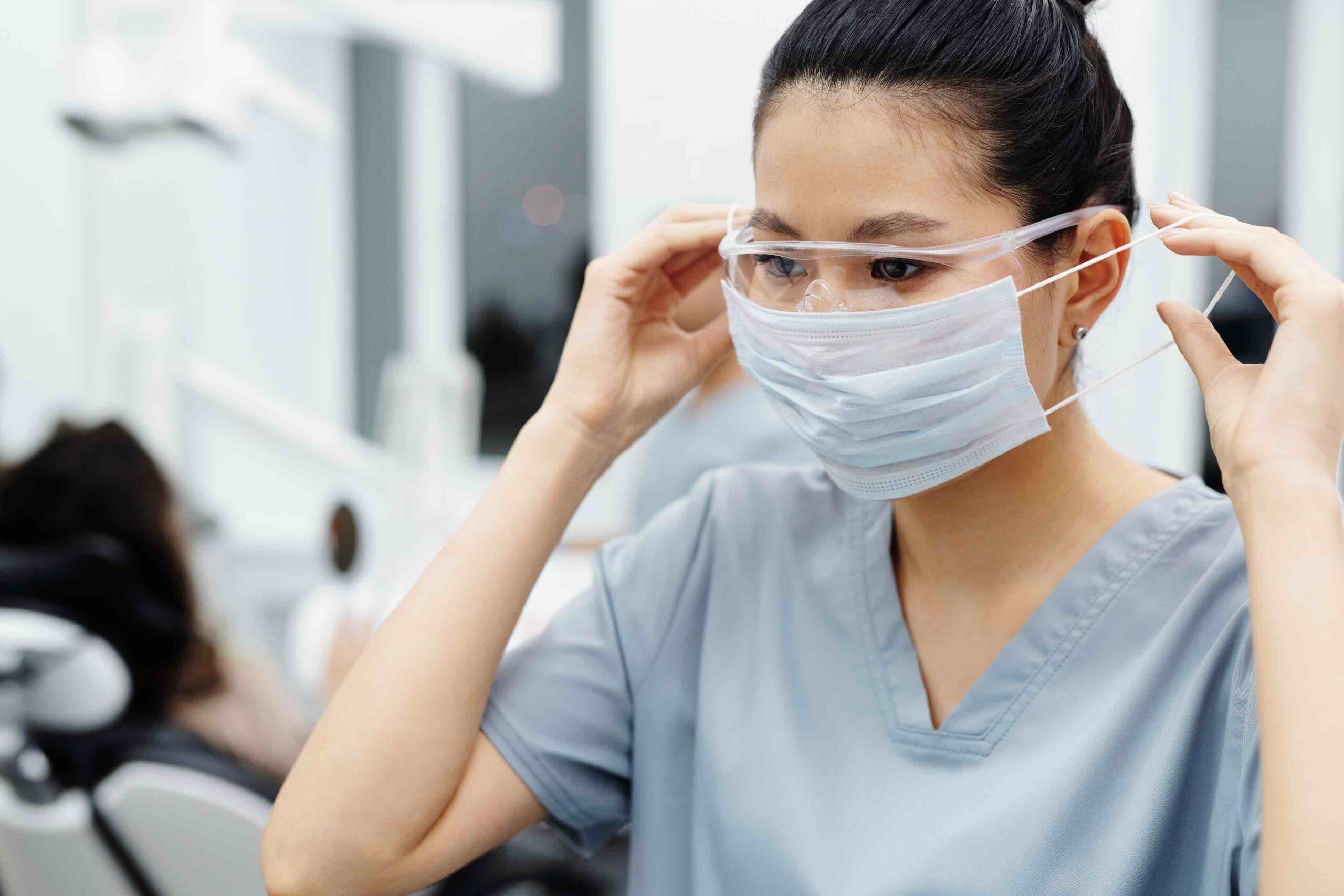 A registered nurse preparing to work in an environment where hygiene is a top priority