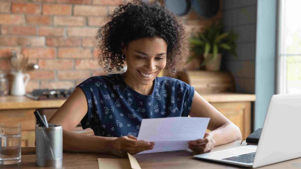 Afro american female young professional proofreading her cover letter