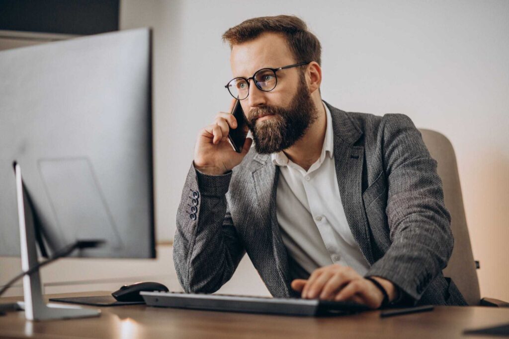 Business man talking on phone taking responsibility for a mistake