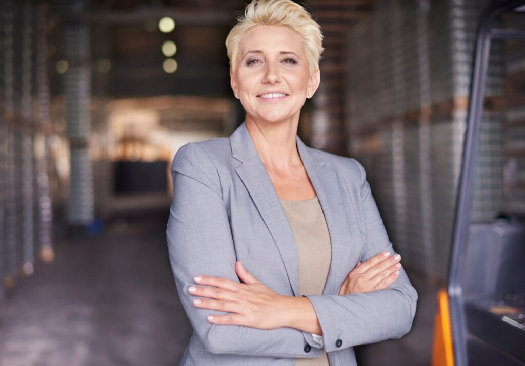 Businesswoman working in warehouse