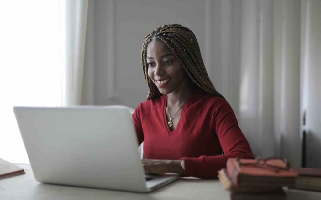 Career woman at desk in the progress of setting SMART goals