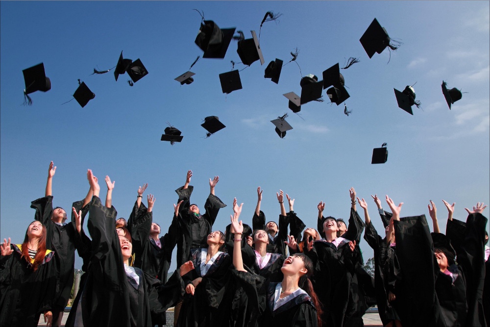 Group celebrating graduation, ready for their pharmacist jobs.