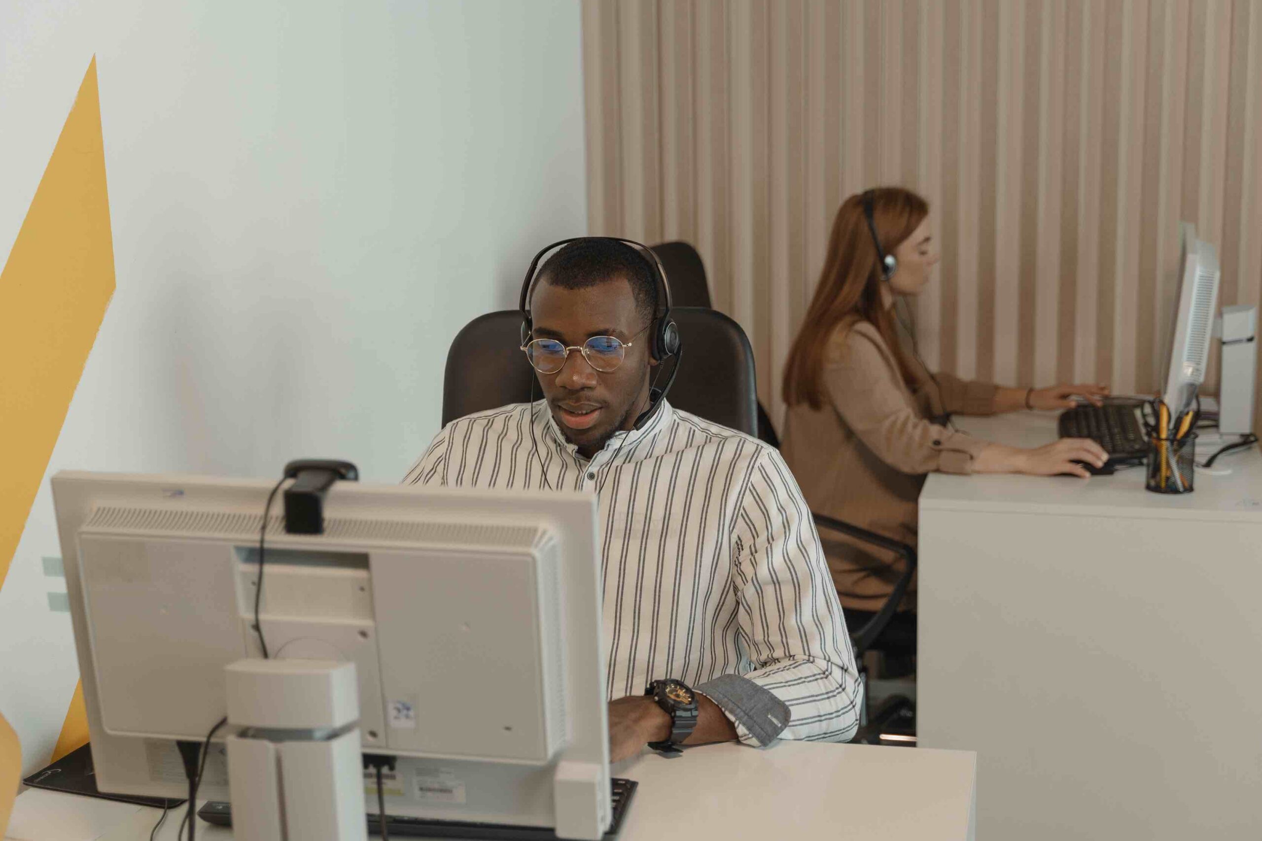 Hiring manager in office on headset conference call