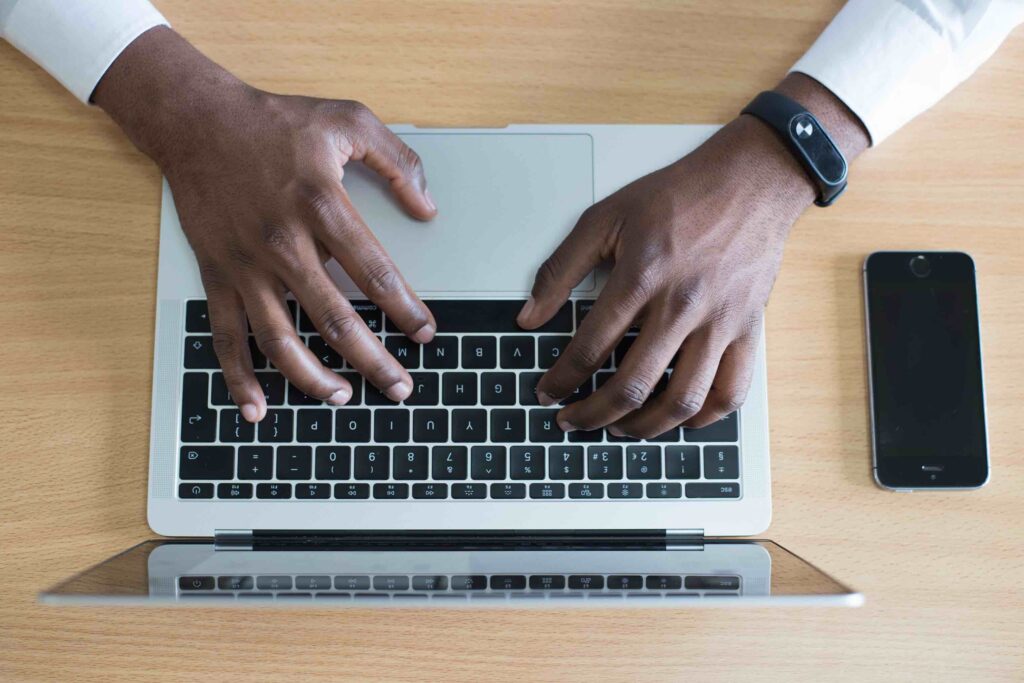 IT consultant at work in front of laptop