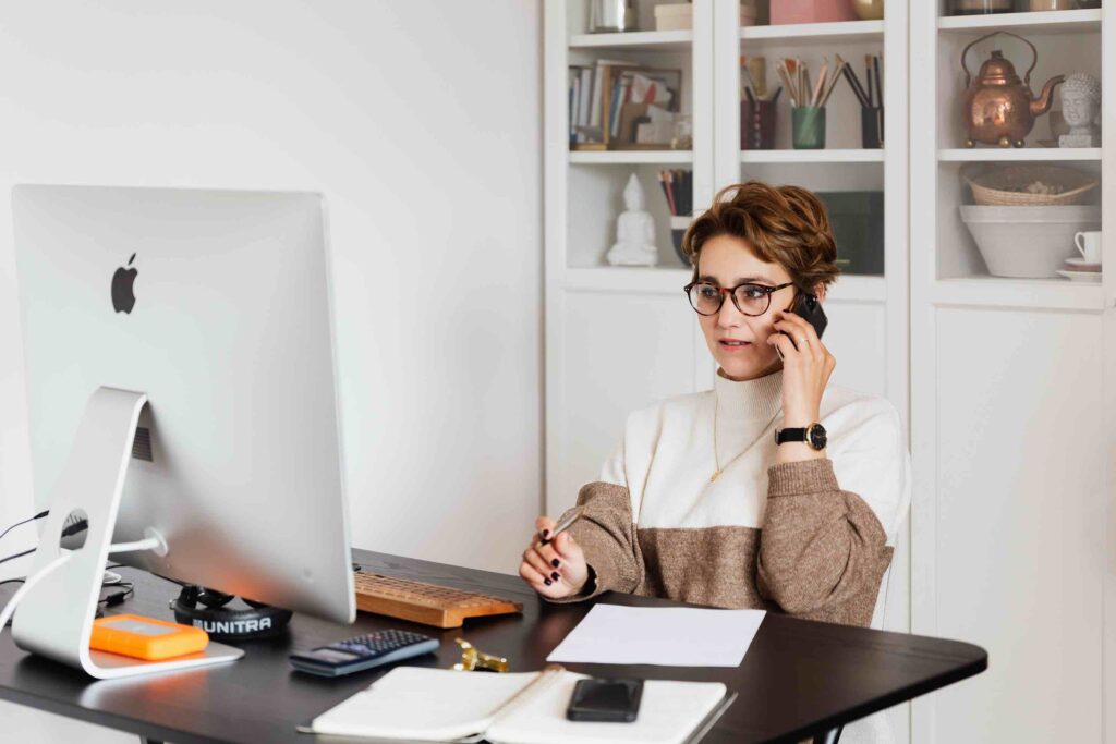 Manager working from home talking on her phone