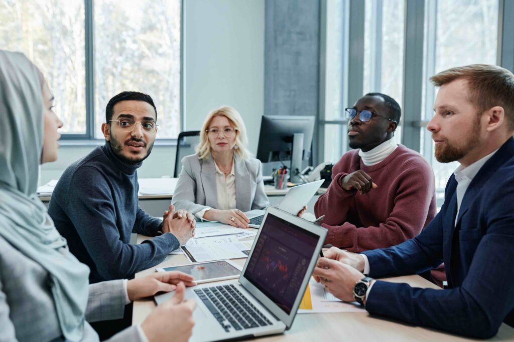 Mid-career employees at work in meeting room