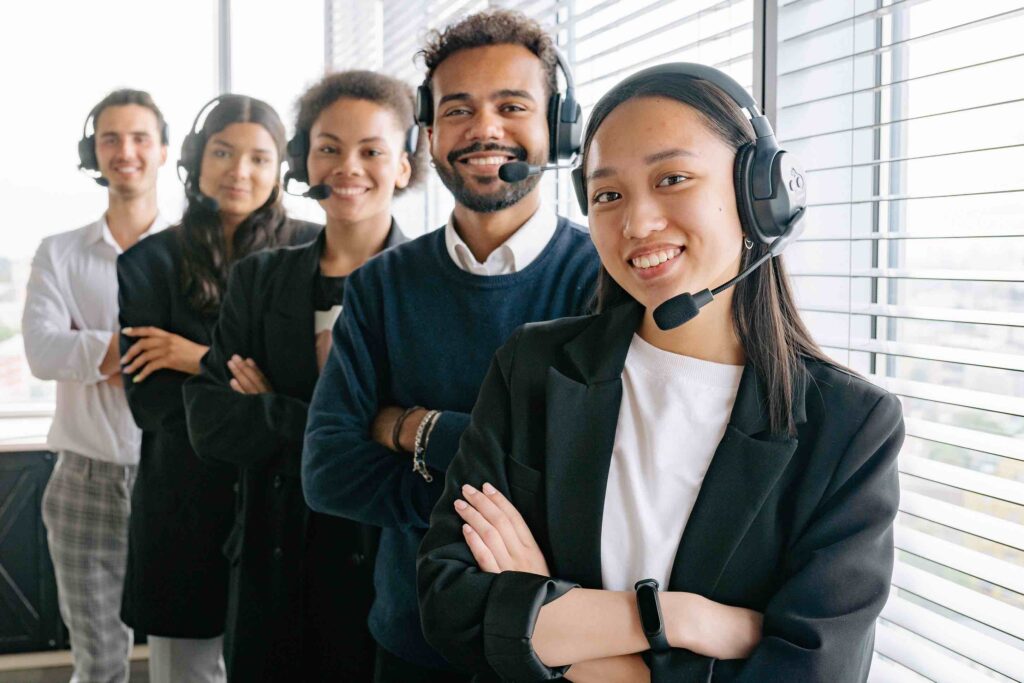 Multiethnic team of smiling customer service representatives