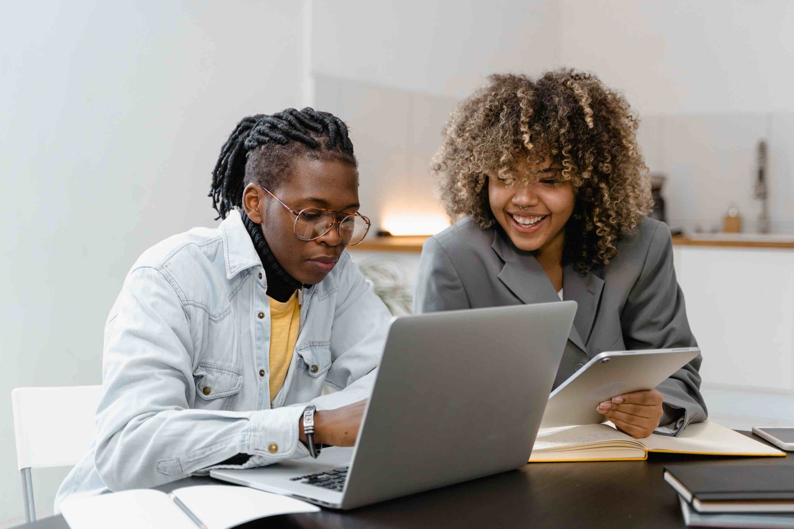 One administrative assistant onboarding a fellow assistant