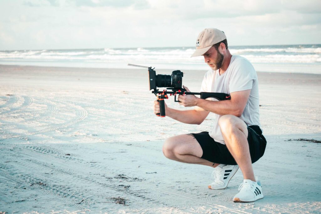 Person at beach filming