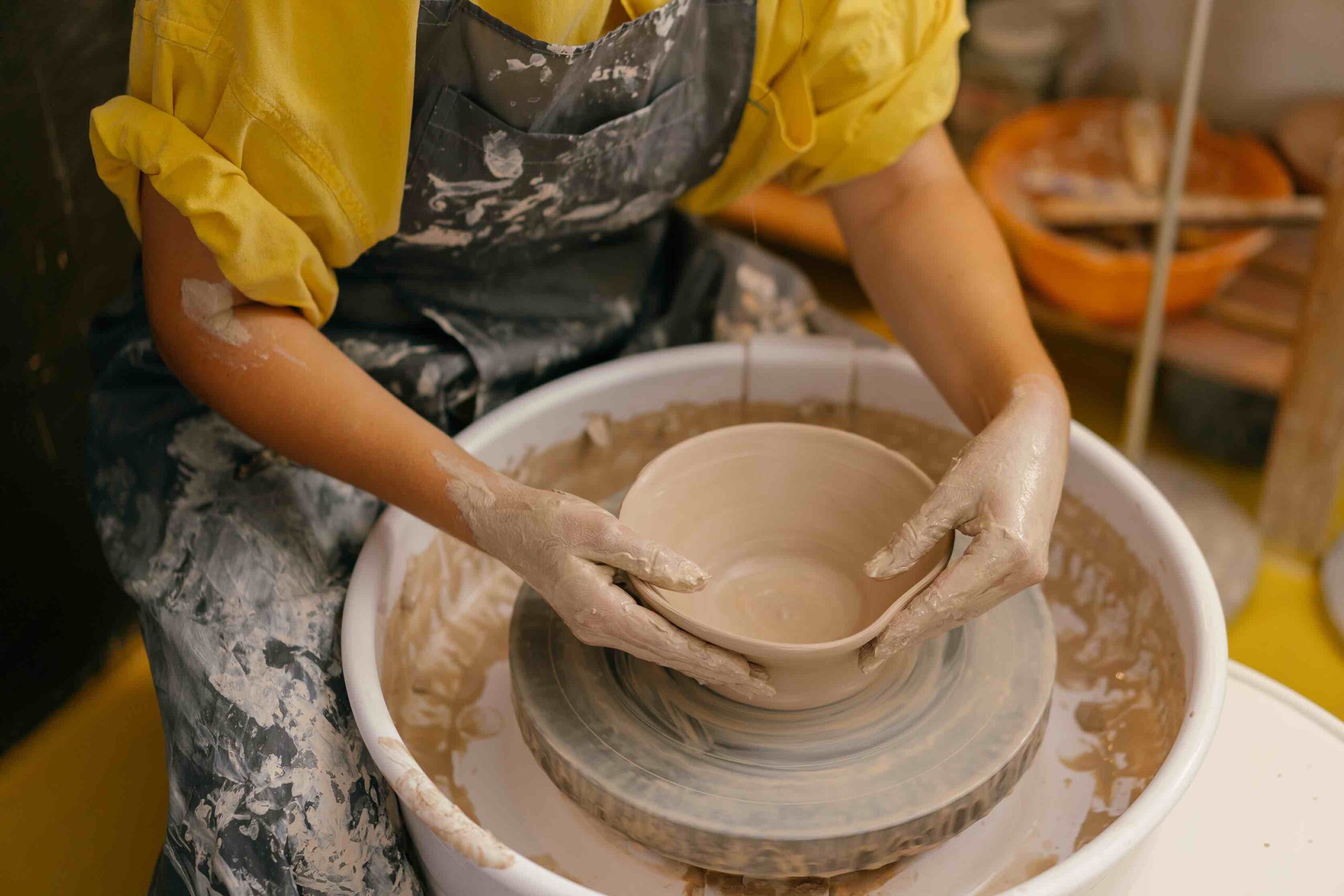 Person doing pottery