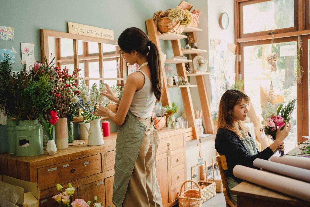 Retail assistant preparing flowers