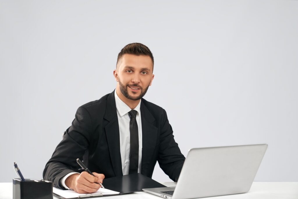 Smiling administrative assistant doing paperwork