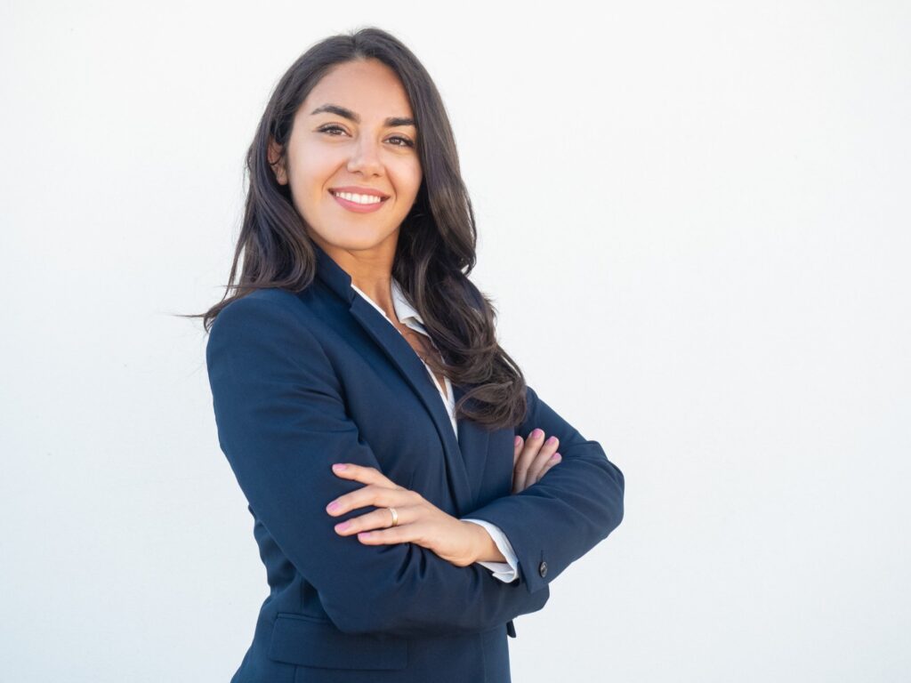 Smiling confident businesswoman posing with arms folded with great hard skills and soft skills