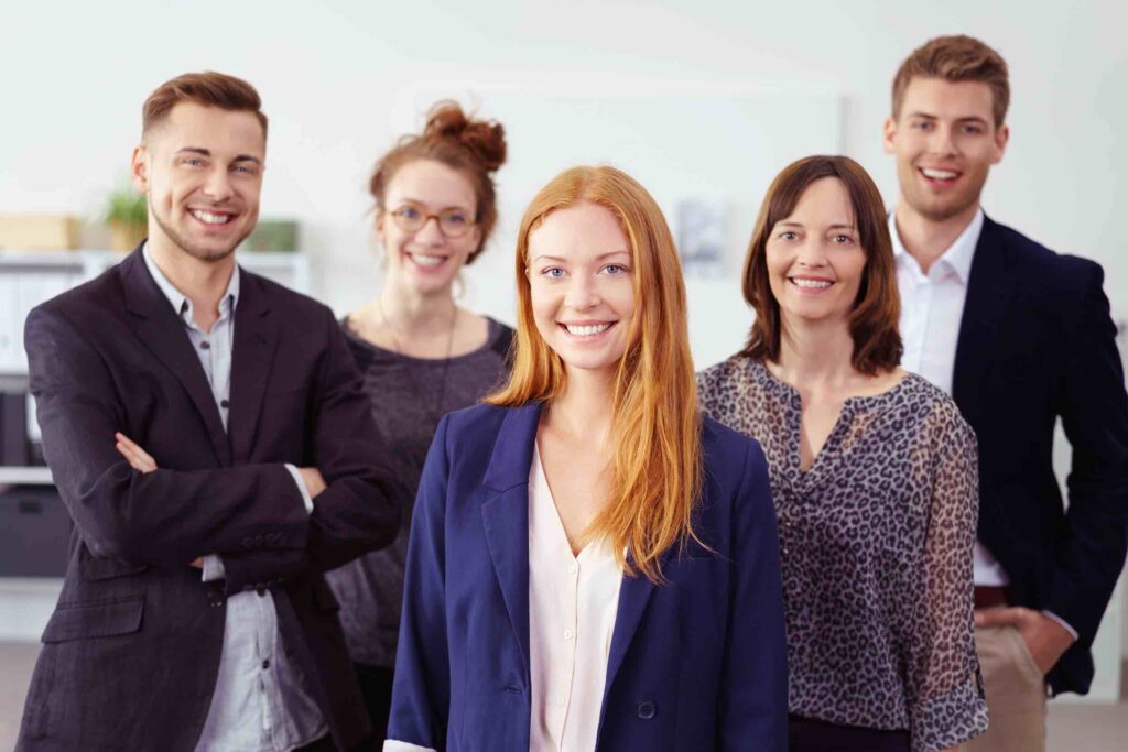 Smiling team members in business casual attire