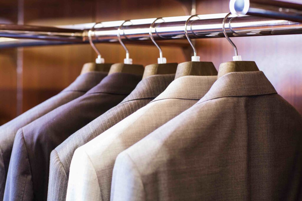 Suits lined up in closet