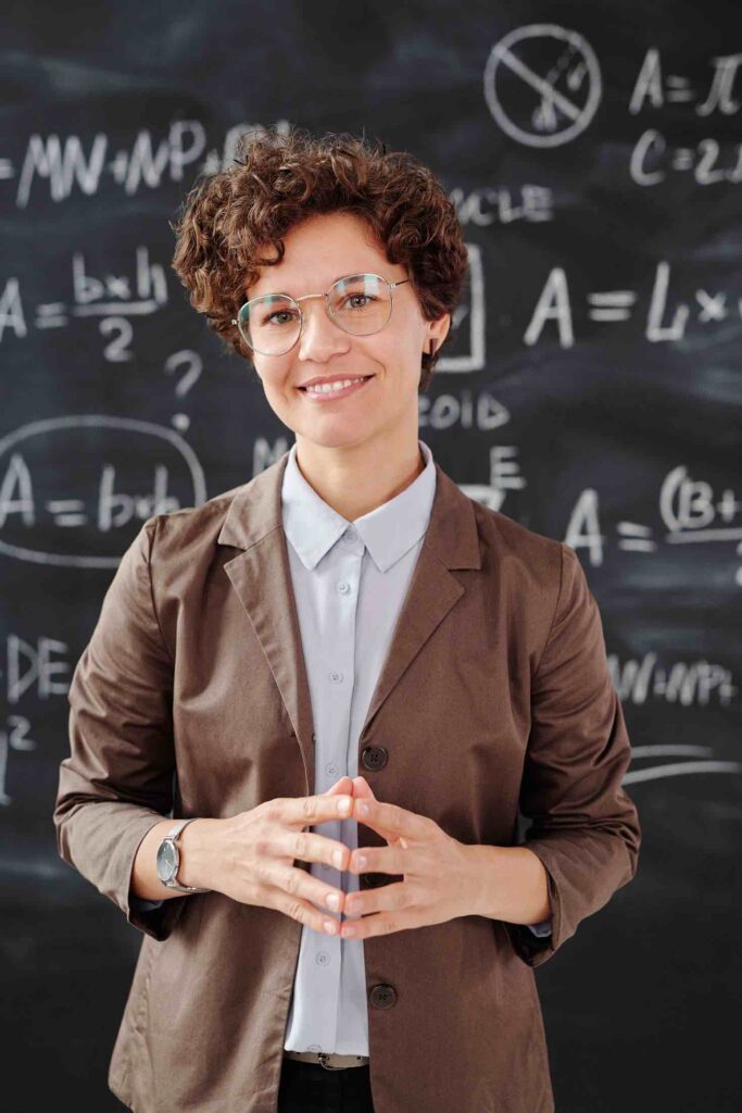 Teacher in front of blackboard