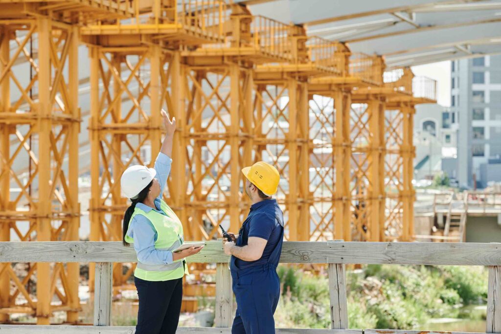 Two construction workers on a building site