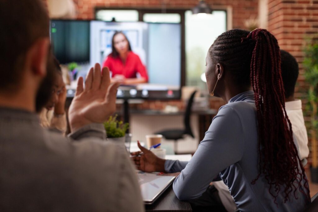 Virtual and on-site team meeting, project managers discuss the project