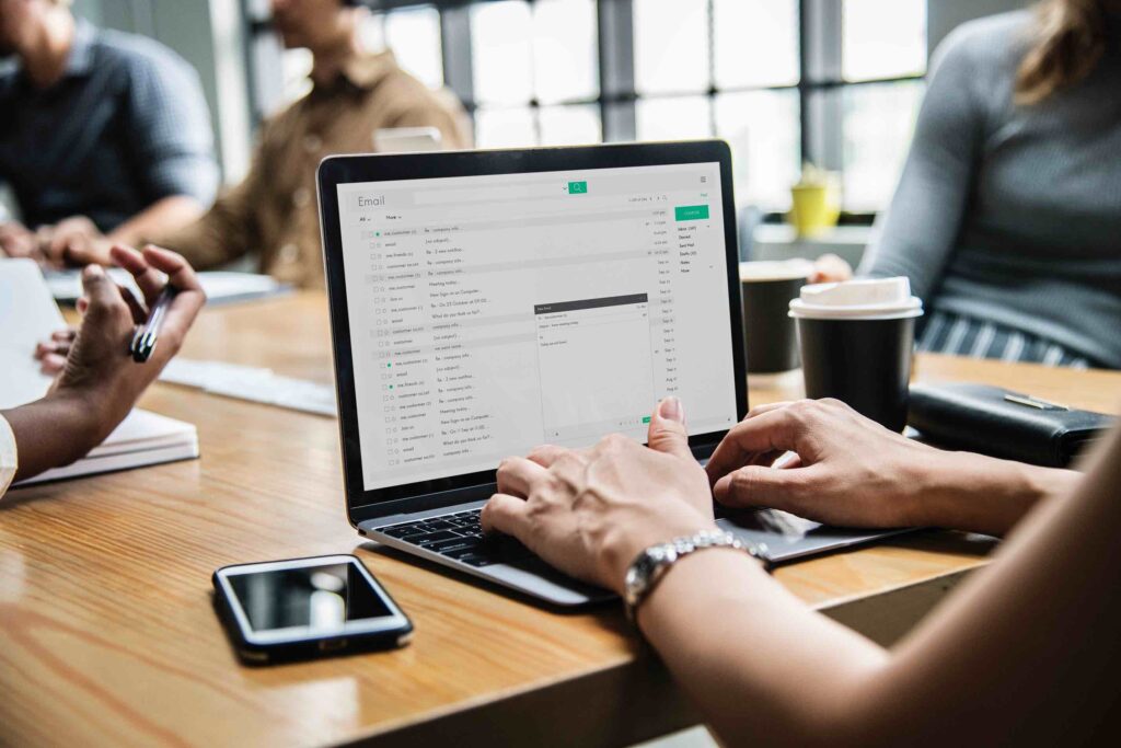 Woman checking her email in a meeting