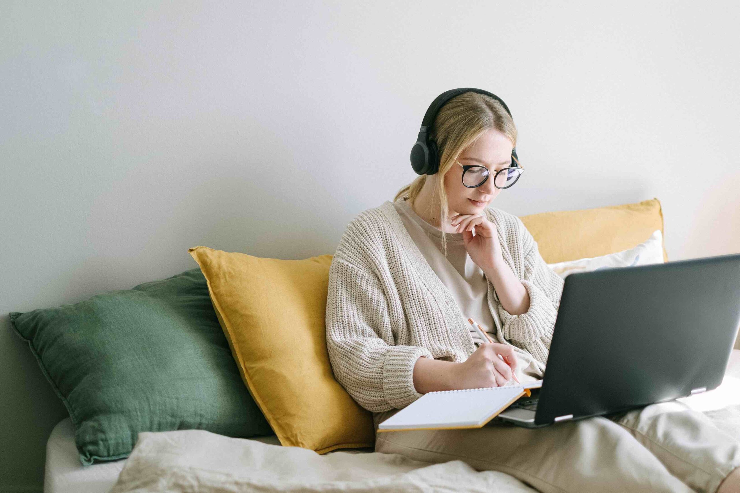 Young applicant writing notes for her career change cover letter