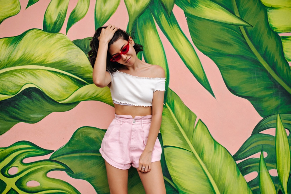 Young woman in casual summer outfit, not suited for a business casual dress code