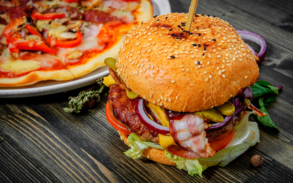 bacon cheeseburger and a pizza