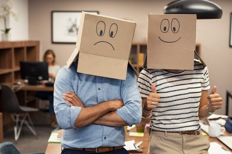 business men have boxes on their heads with faces on them