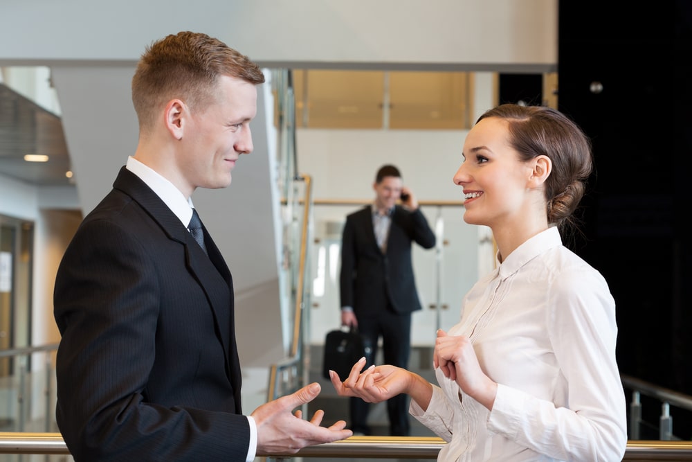 business talk between two young employers