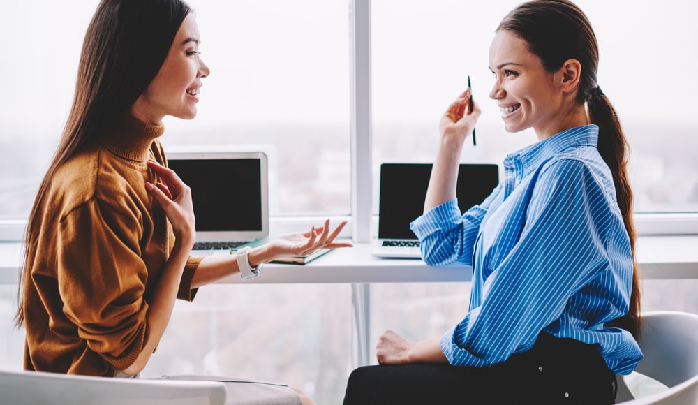 smiling business women chatting