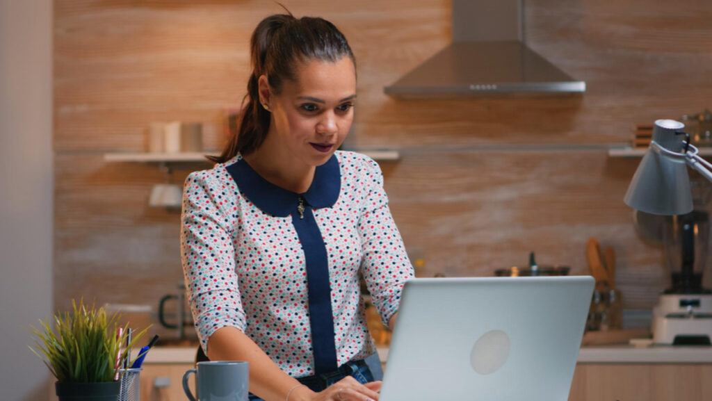 Businesswoman checking a personal reference letter on her laptop