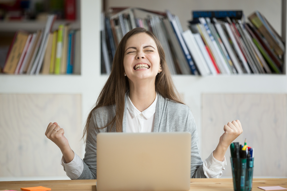 Excited,Female,Student,Feels,Euphoric,Celebrating,Online,Win,Success,Achievement