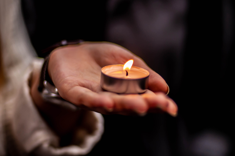 candle held in hand