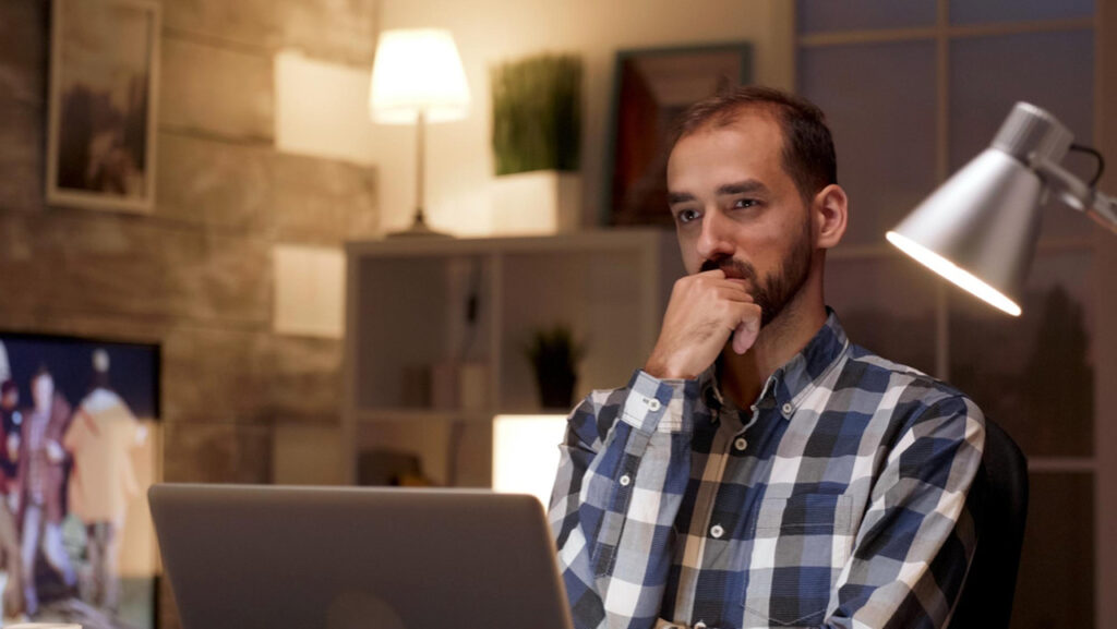 Professor about to draft a character reference letter on his laptop