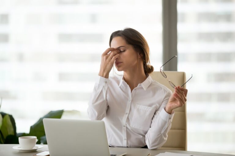 female business employee with headache