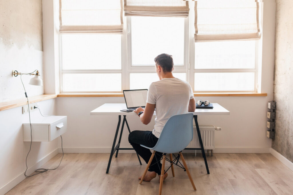 Freelancer working from home about to write a problem statement on his laptop