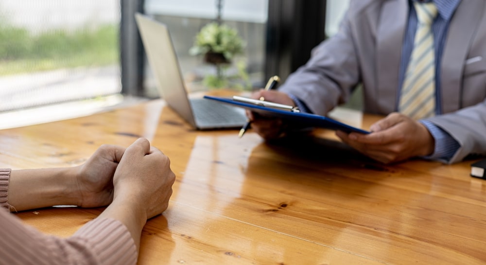 two person are reviewing the salary history