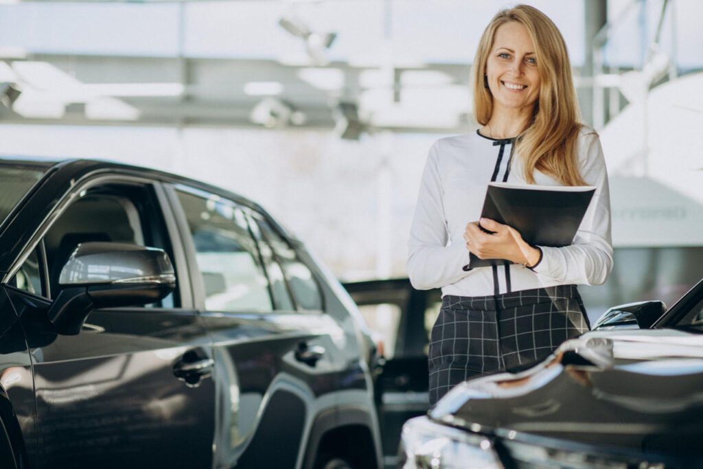 Sales woman in a car showroom