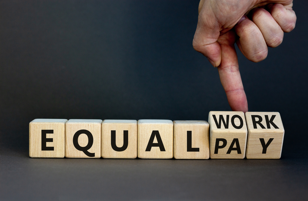 Equal,Pay,And,Work,Symbol.,Businessman,Turns,Wooden,Cubes,And