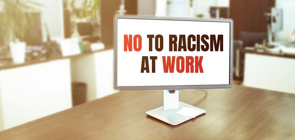 Monitor,In,Modern,Office,With,No,To,Racism,At,Work