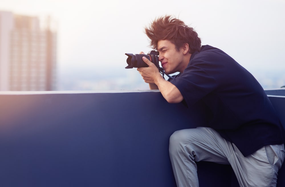 Young man taking photo