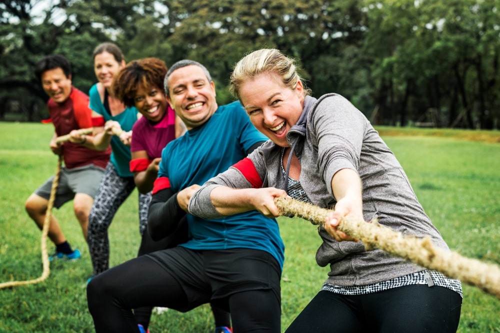 Friends playing tug of war