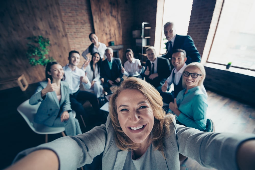 Work colleagues make a selfi together