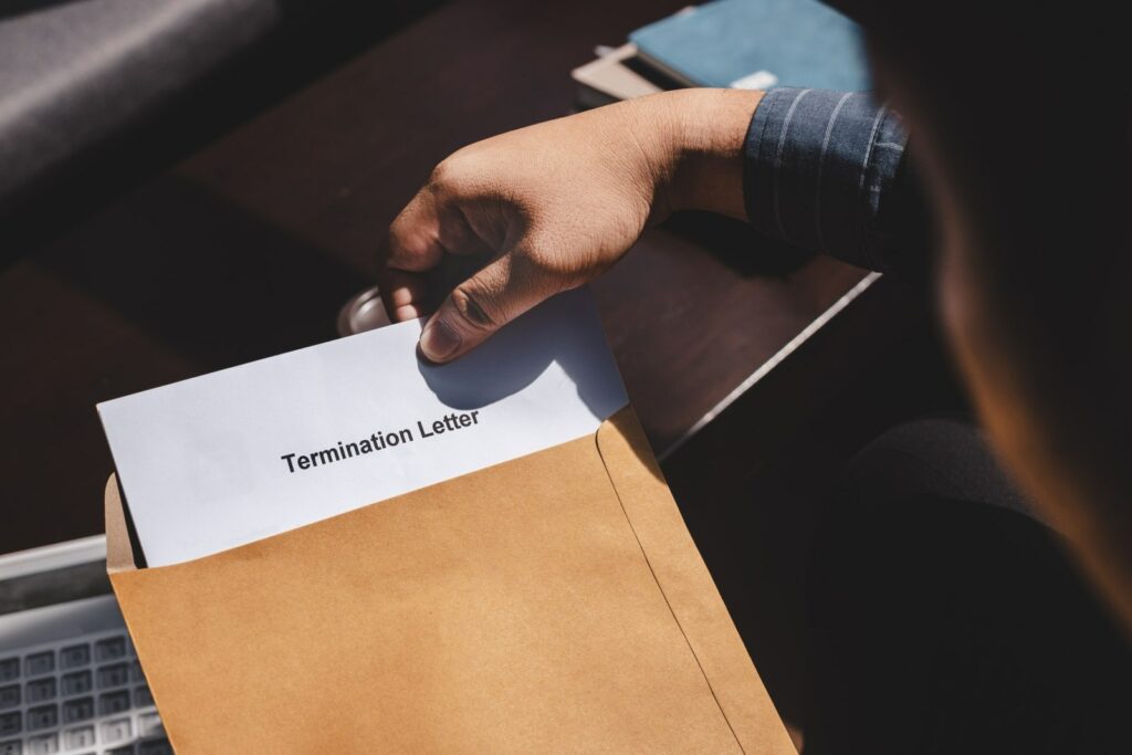 A guy looking at a Termination letter 