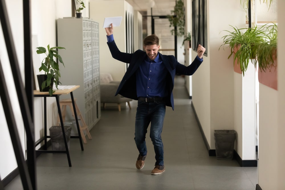 happy dancing man after winning his salary negotiation