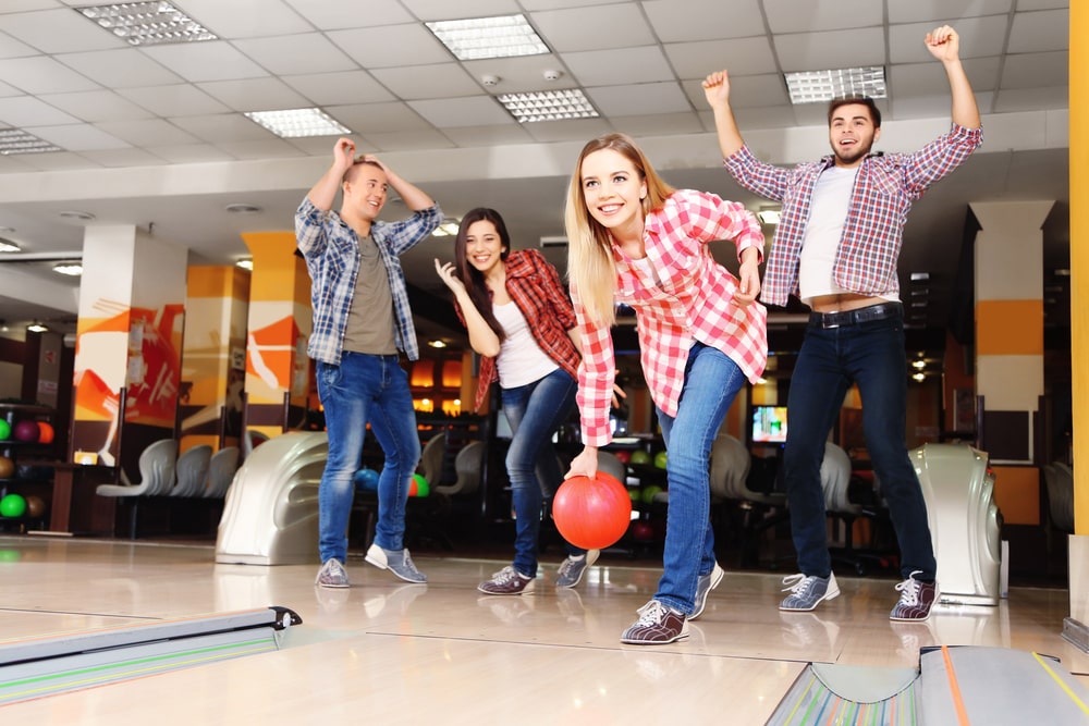 colleagues play bowling after work