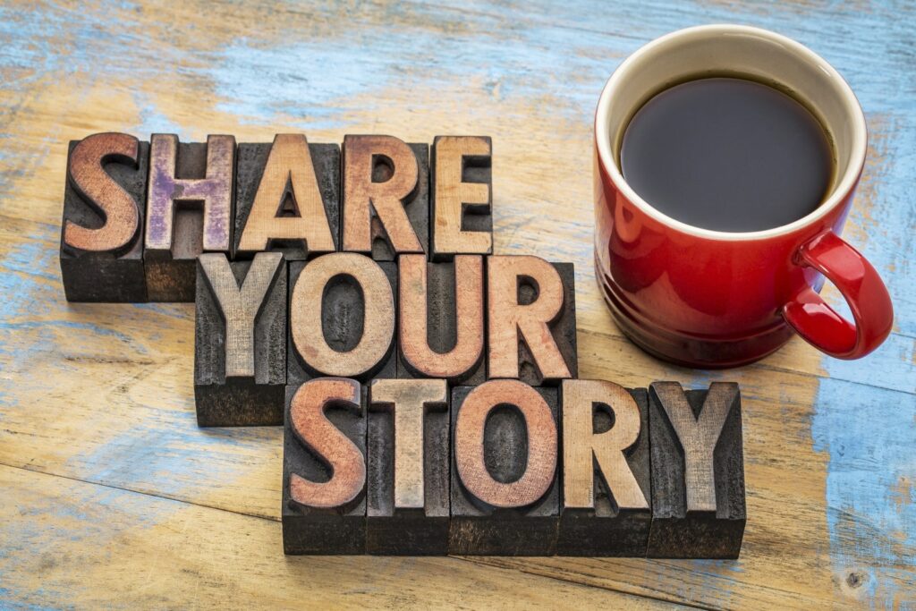 the words "share your story" laying next to coffee