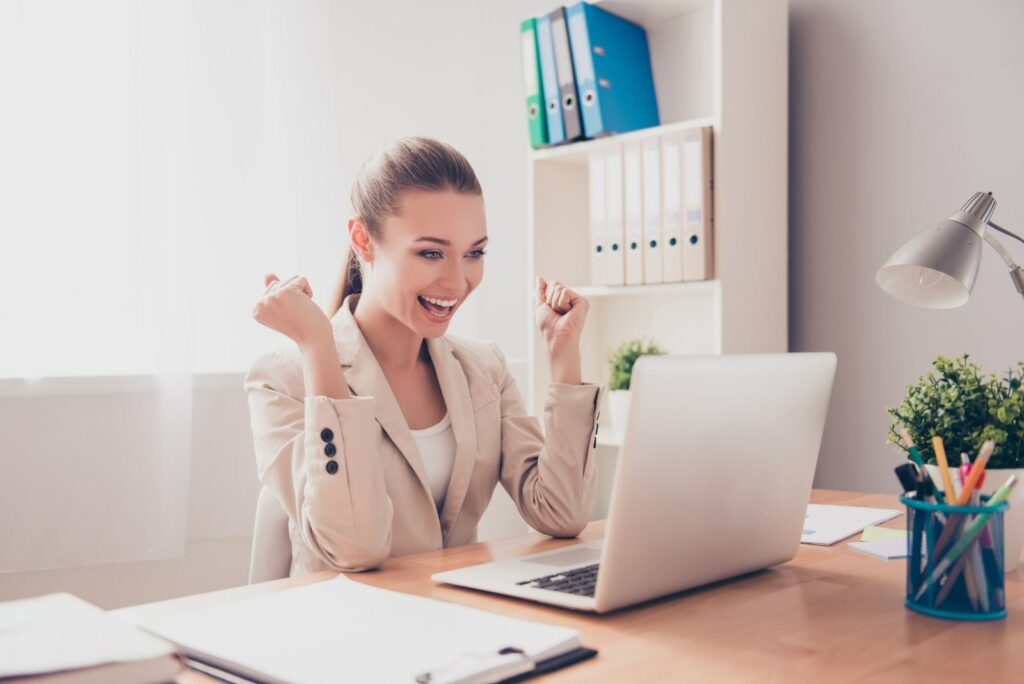 a woman becoming happy after ready her perfect cover letter