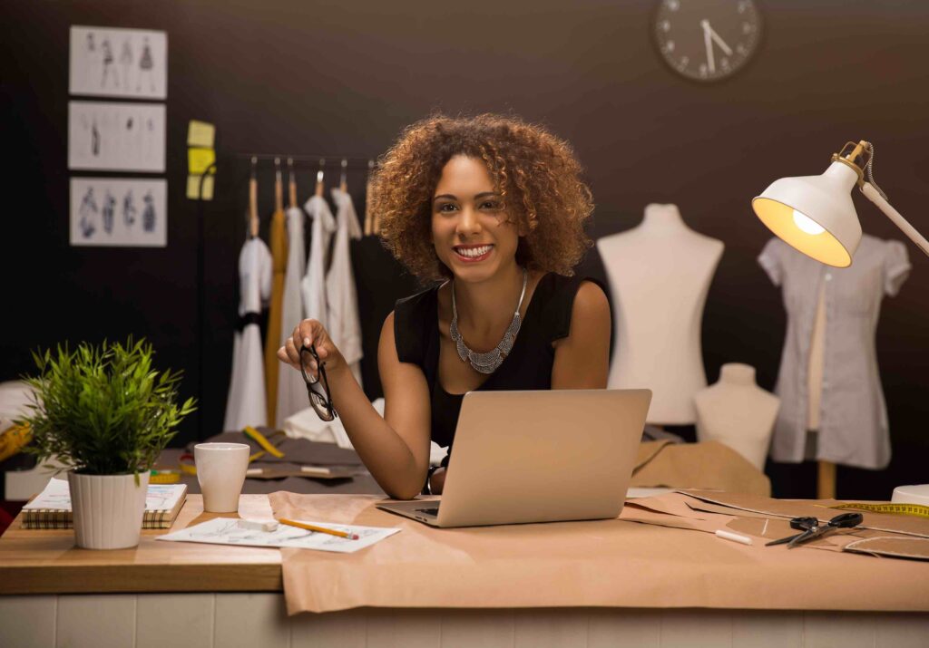 Young woman, In her studio, Designer, Laptop, Carrying glasses, Smiling, Cool surroundings