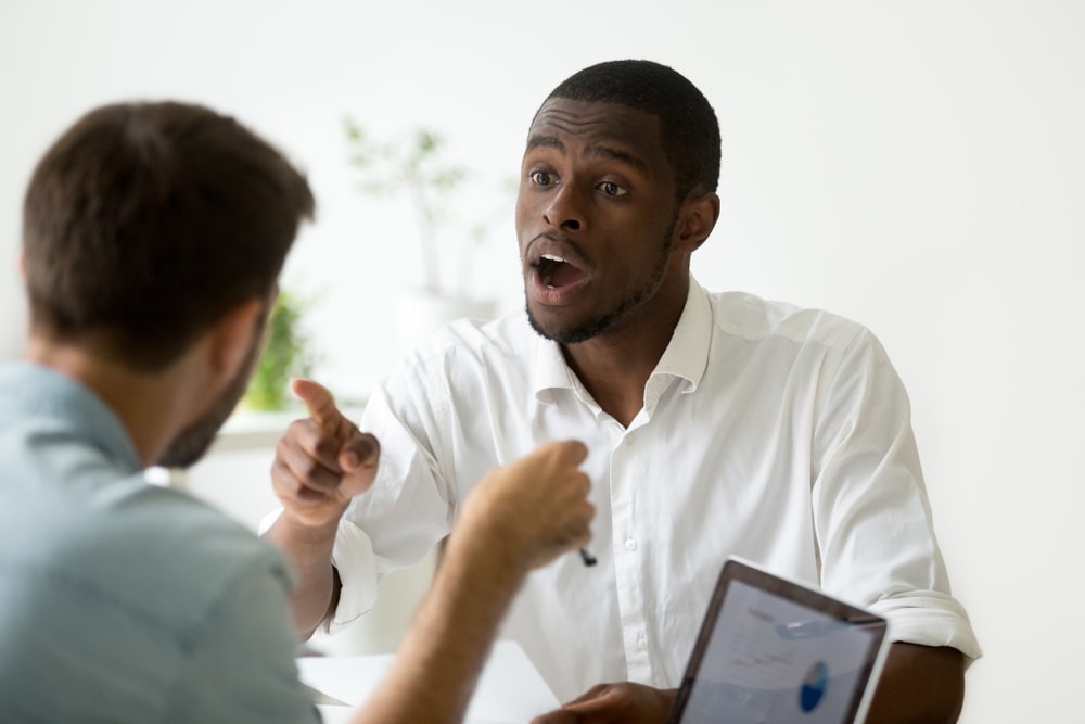 two colleagues discuss with each other