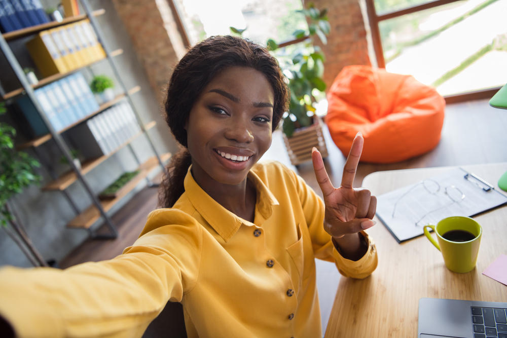 woman showing her home office